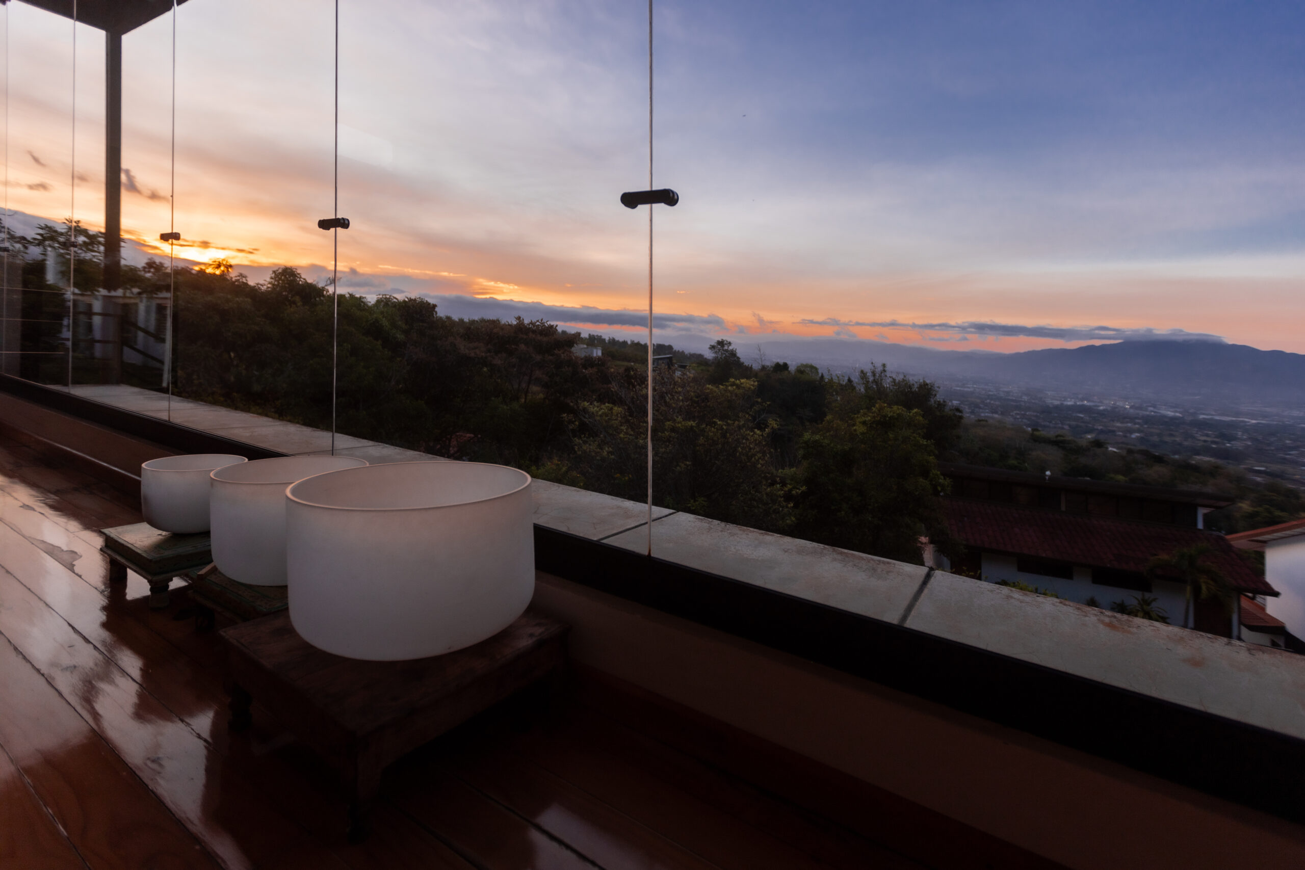 Spacious yoga hall overlooking Costa Rica's lush Central Valley, where guests gather for yoga, meditation, and mindful movement.